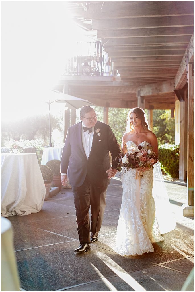Bride and father of the bride walking down the aisle at Auberge du Soleil