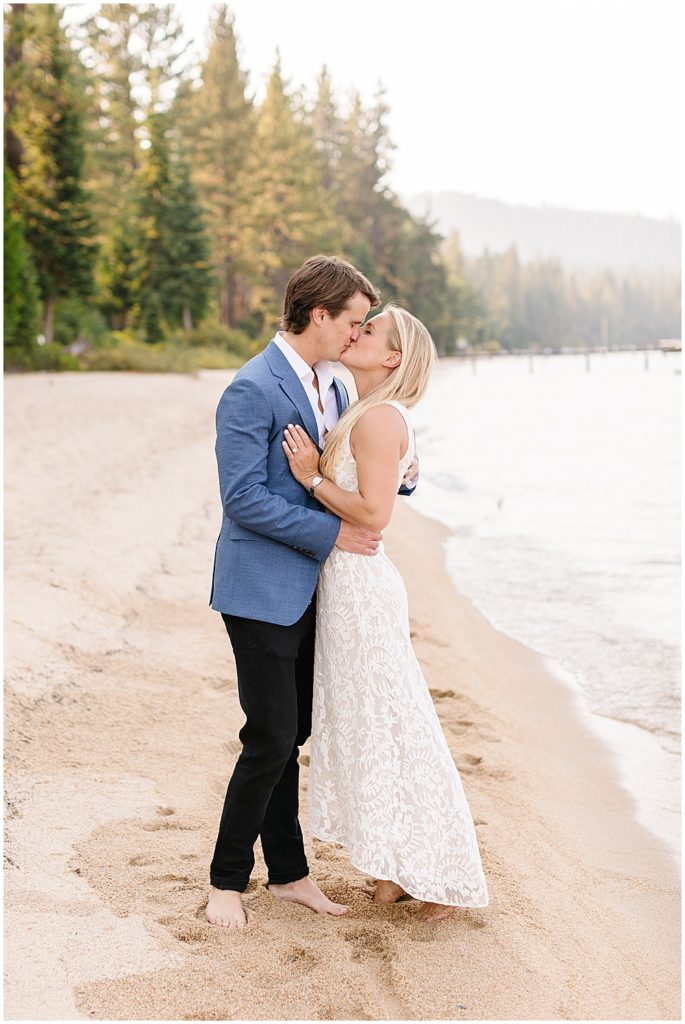 bride and groom kissing on beach in Lake Tahoe